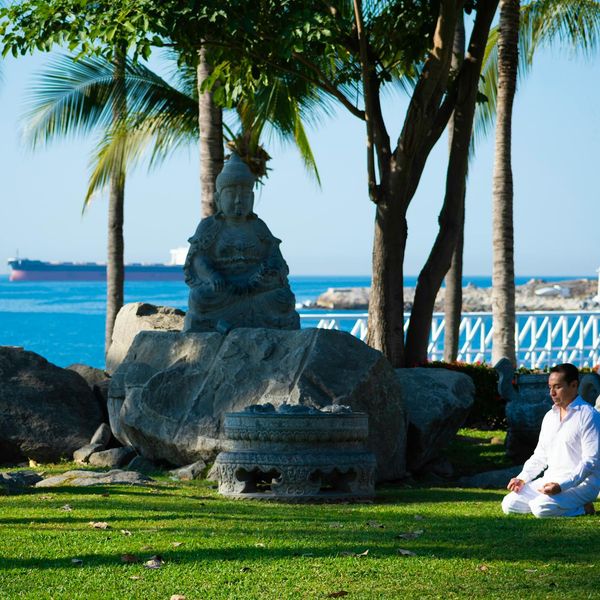 A man meditating outdoors, symbolizing mental clarity and inner peace.